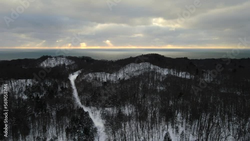 Lake Michigan Winter. Sun setting through dense clouds. photo