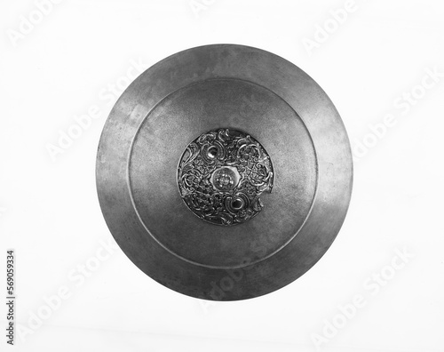 ancient round iron shield isolated on white background