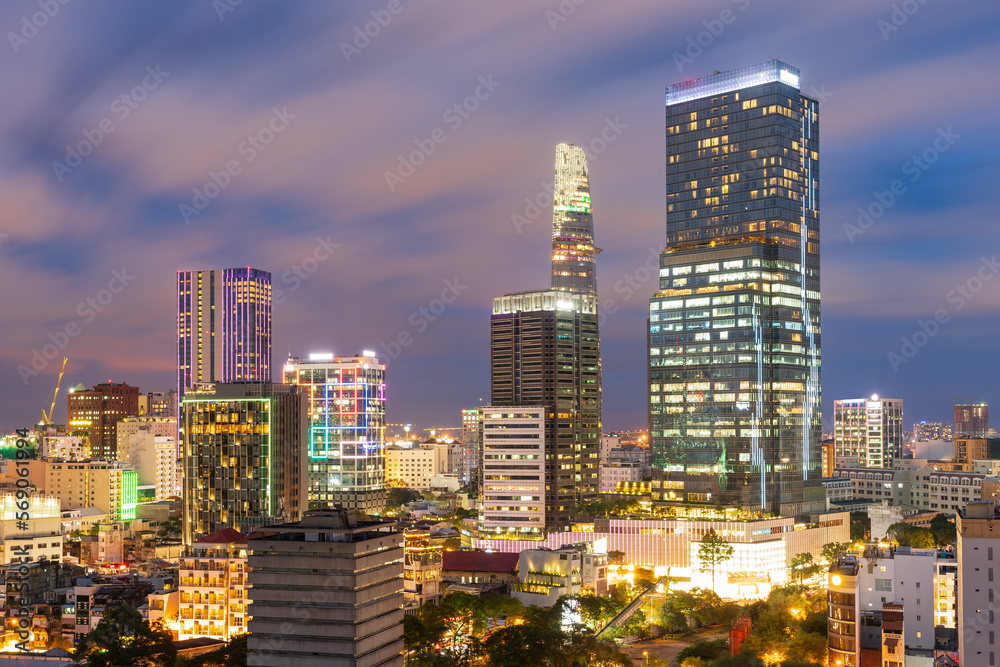Elevated view of high rise city buildings lit up on twilight at Ho Chi Minh in Vietnam