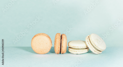 Beige and Brown French macaron cookies close-up.
