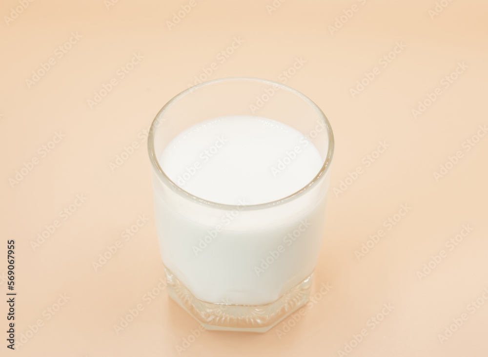 Glass of milk Isolated on a color background. Dairy product close-up. Drink milk for a good health. Cow milk. good product of social. copy space for text. Glass of milk Isolated on a color background. Dairy product close-up. Drink milk for a good health. Cow milk. good product of social. copy space for text.