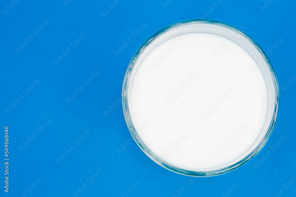 Glass of milk Isolated on a color background. Dairy product close-up. Drink milk for a good health. Cow milk. good product of social. copy space for text. Glass of milk Isolated on a color background. Dairy product close-up. Drink milk for a good health. Cow milk. good product of social. copy space for text.