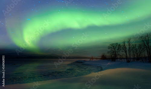 Northern lights or Aurora borealis in the sky over Tromso fjords - Tromso, Norway