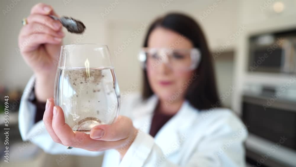 Soil test, female agricultural scientist conducting a soil test in a scientific lab in. soil agricultural agronomist in australia, soil microbial test in a scientific lab. Soil microbes Soil test, female agricultural scientist conducting a soil test in a scientific lab in. soil agricultural agronomist in australia, soil microbial test in a scientific lab. Soil microbes
