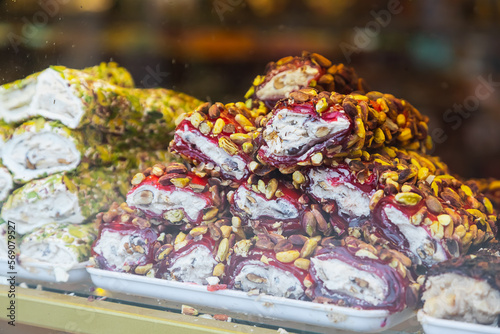 Eastern sweets. Traditional Turkish baklava with hazelnuts Arabian dessert  baklava  halva  Turkish delight in briquettes on a shop window