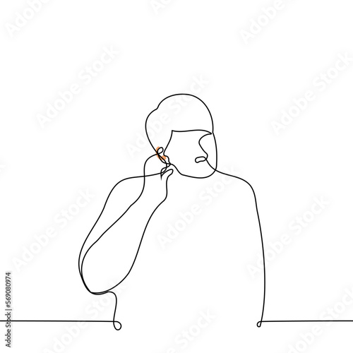 man puts a hearing aid in his ear - one line drawing vector. concept hearing impaired, hearing problems, deaf person with a hearing aid