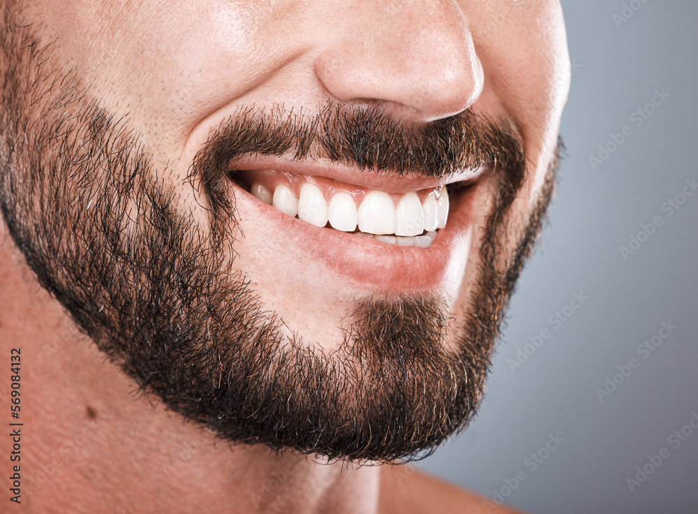 Smile, dental health and mouth of a man with teeth isolated on grey