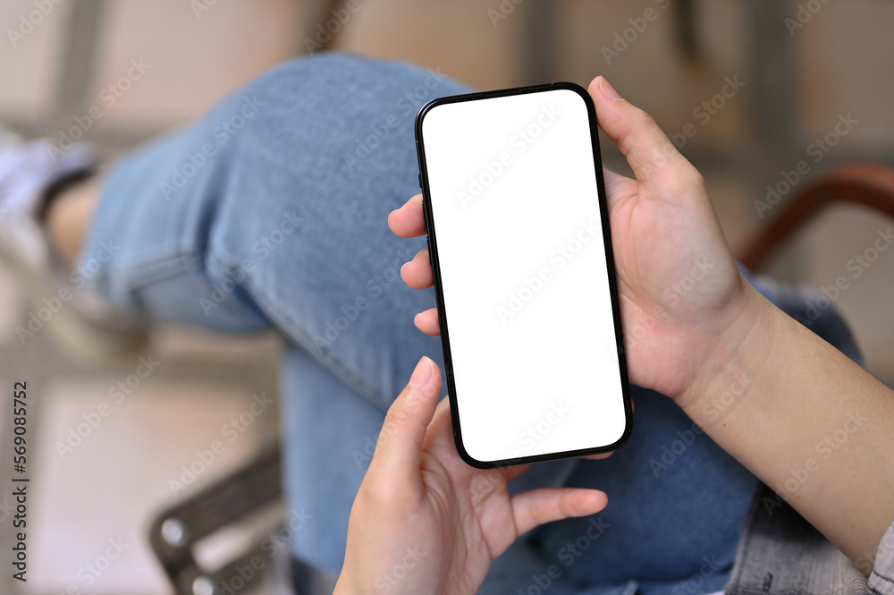 Top view of a female using her smartphone while relaxing in the backyard. phone mockup Top view of a female using her smartphone while relaxing in the backyard. phone mockup