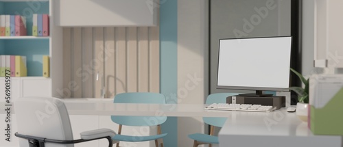 Modern contemporary doctor office or examination room with computer mockup and stuff photo