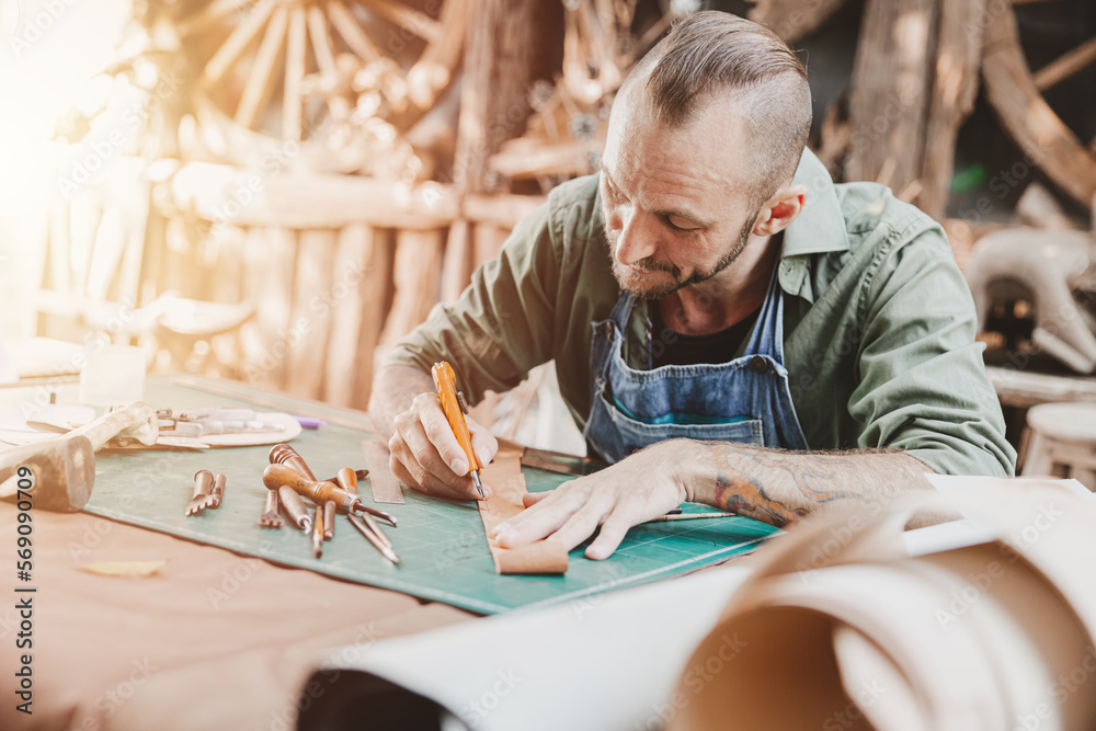 Leather maker artist handcraft working at own workshop small studio made by order masterwork piece Leather maker artist handcraft working at own workshop small studio made by order masterwork piece