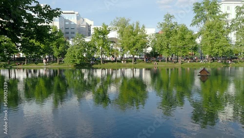 People resting at the Clean ponds or Chistye Prudy pond during warm sunny day in Moscow Russia
 photo