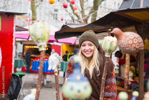 Portrait of young woman at Christmas market photo