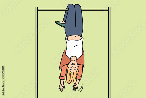 Overjoyed young woman hanging on horizontal bar upside down. Smiling girl have fun exercising outdoors on sport playground. Vector illustration. 