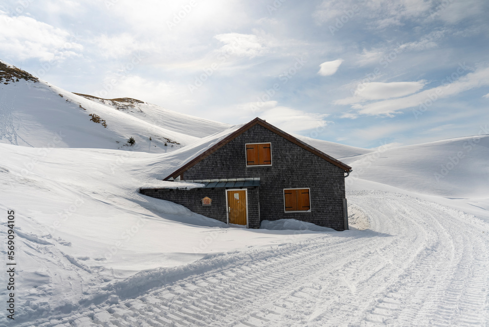 Mountain cabin covered with snow Mountain cabin covered with snow