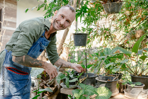 Behang portrait happy hipster male at  garden enjoy relax at home backyard plant tree c