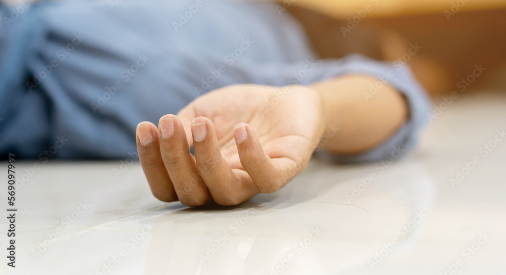 close up adult man hand lying on home's floor in living room after got fainted symptom from heart attack syndrome for health lifestyle concept close up adult man hand lying on home's floor in living room after got fainted symptom from heart attack syndrome for health lifestyle concept