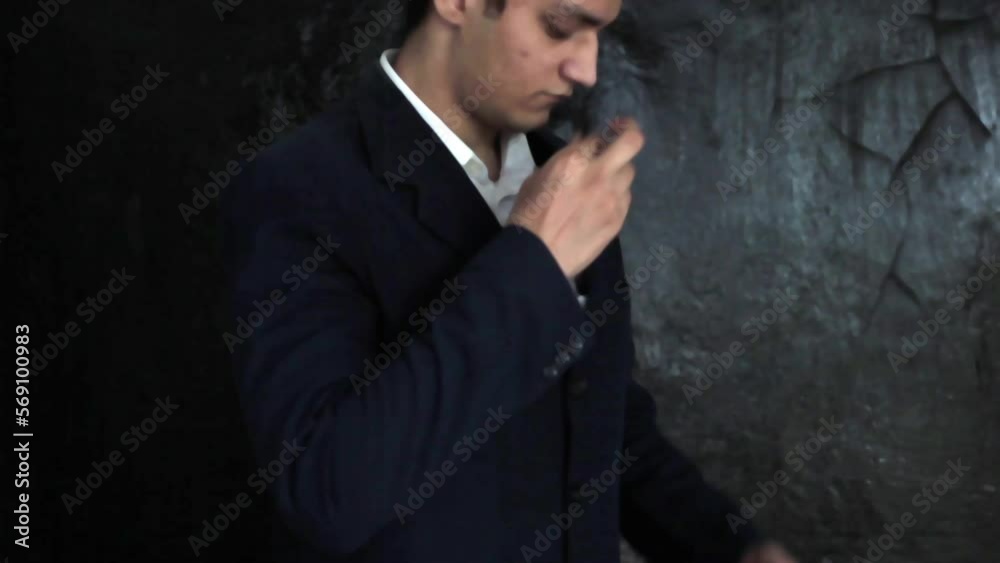 A young CEO takes his phone out noting something in his mobile and putting it back, Hd footage. Young businessmen promoting cell phones. A young CEO takes his phone out noting something in his mobile and putting it back, Hd footage. Young businessmen promoting cell phones.