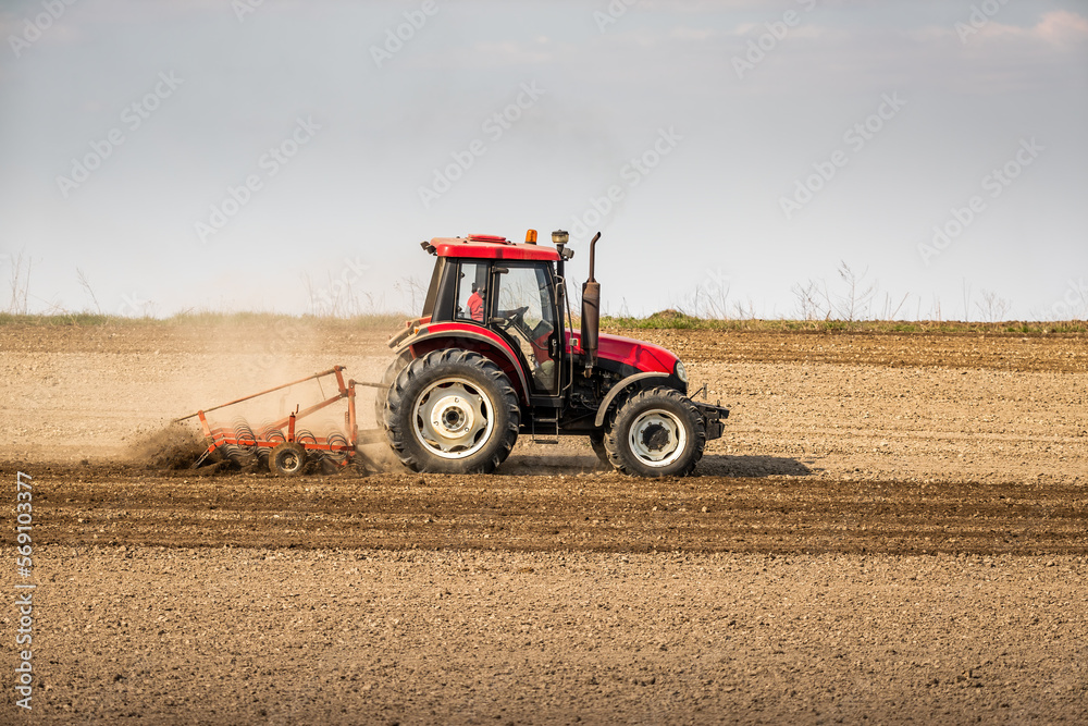 Fields of possibility, tractor readying the earth for a bountiful harvest Fields of possibility, tractor readying the earth for a bountiful harvest