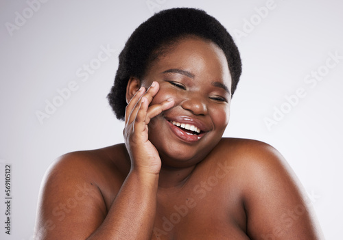 Body wellness, skincare and smile of black woman in studio for health, beauty and luxury cosmetics. Spa, aesthetic, dermatology and face of plus size girl with glowing skin, self love and makeup