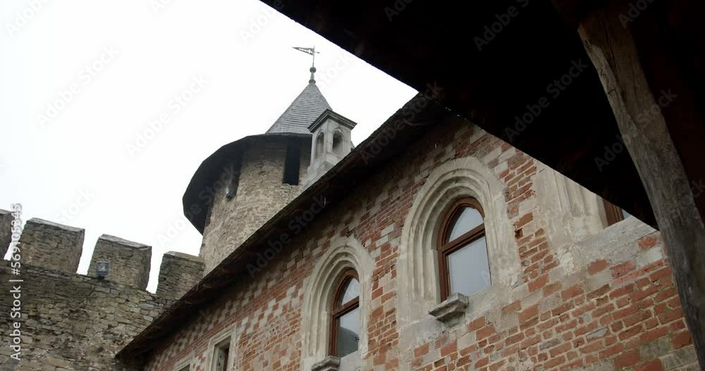 the tower of the ancient fortress in Khotyn Castle in the rain. rain falls on the walls of the fortress the tower of the ancient fortress in Khotyn Castle in the rain. rain falls on the walls of the fortress
