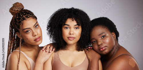 Portrait, skincare and diversity with woman friends in studio on a gray background together for beauty. Face, makeup and natural with a female model group posing to promote support or inclusion