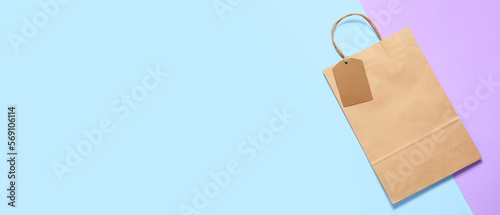 Paper shopping bag on color...