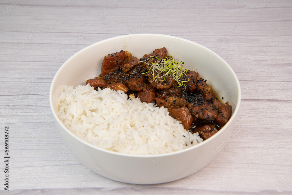 Caramel pork recipe with rice and black sesame seeds. High quality photo Caramel pork recipe with rice and black sesame seeds. High quality photo