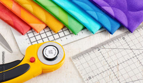 Set of rainbow colored quilting fabrics, accessories for quilting and sewing