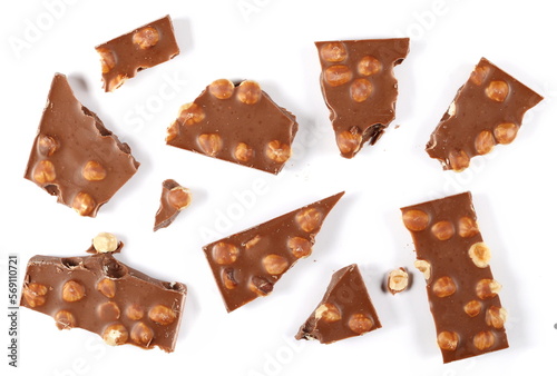Chocolate bars set with hazelnut, pieces isolated on white background, top view
