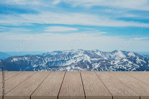Wooden table with mountains landscape