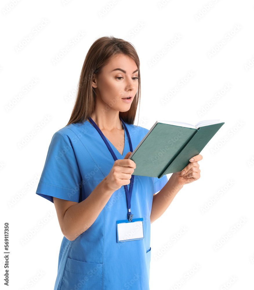 Female medical assistant reading book on white background Female medical assistant reading book on white background