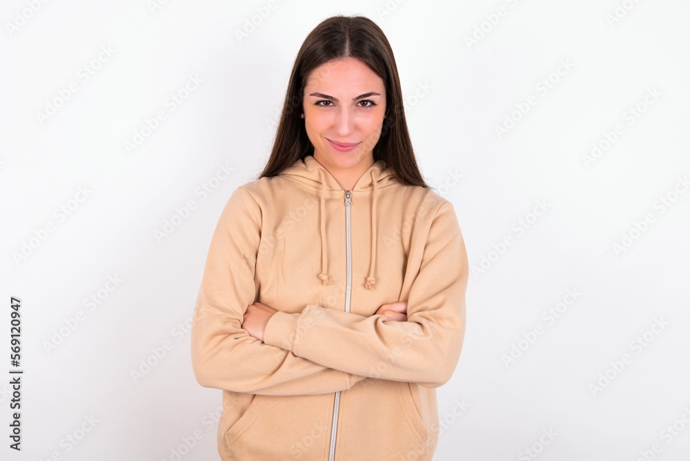 young woman wearing beige sweater over white studio background Pointing down with fingers showing advertisement, surprised face and open mouth young woman wearing beige sweater over white studio background Pointing down with fingers showing advertisement, surprised face and open mouth