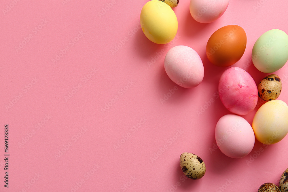 Natural and painted Easter eggs on pink background