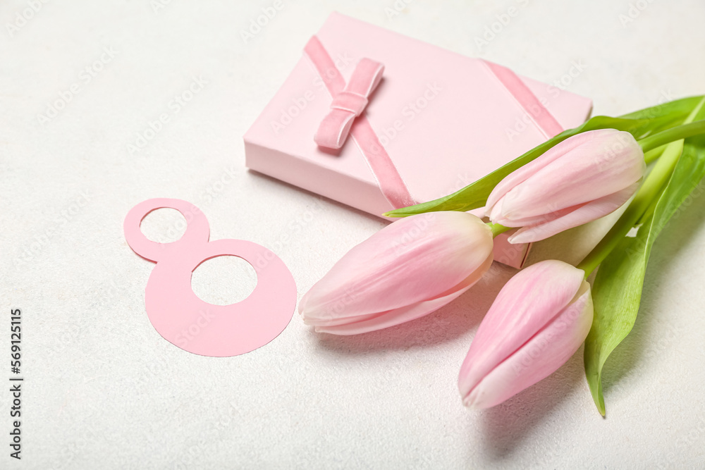 Beautiful tulip flowers, number 8 and gift for Women's Day celebration on white background Beautiful tulip flowers, number 8 and gift for Women's Day celebration on white background