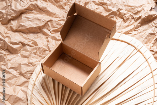 Small brown cardboard box for item shipping, mock up