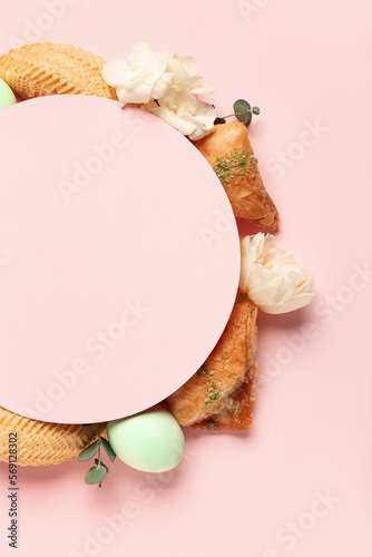 Blank card with flowers, eggs and treats on pink background. Novruz Bayram celebration photo