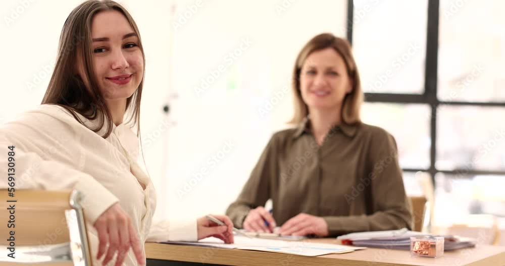Smiling businesswoman at table with partner in working office 4k movie slow motion Smiling businesswoman at table with partner in working office 4k movie slow motion