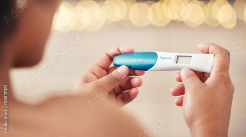 Pregnancy test, woman and hands check results of medical information at home. Closeup, fertility stick or family planning for maternity wellness, pregnant hormone or ivf healthcare treatment for baby