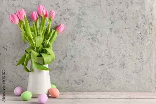 Pink tulips in white vase w...
