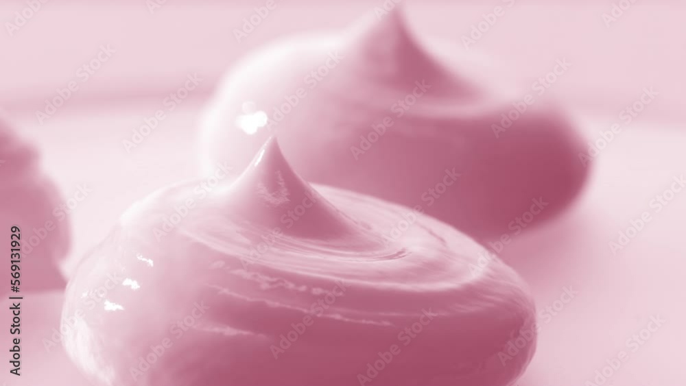 Macro crane turntable shot of three pink cosmetic cream drops on pink background | Cosmetic cream advertisement Macro crane turntable shot of three pink cosmetic cream drops on pink background | Cosmetic cream advertisement