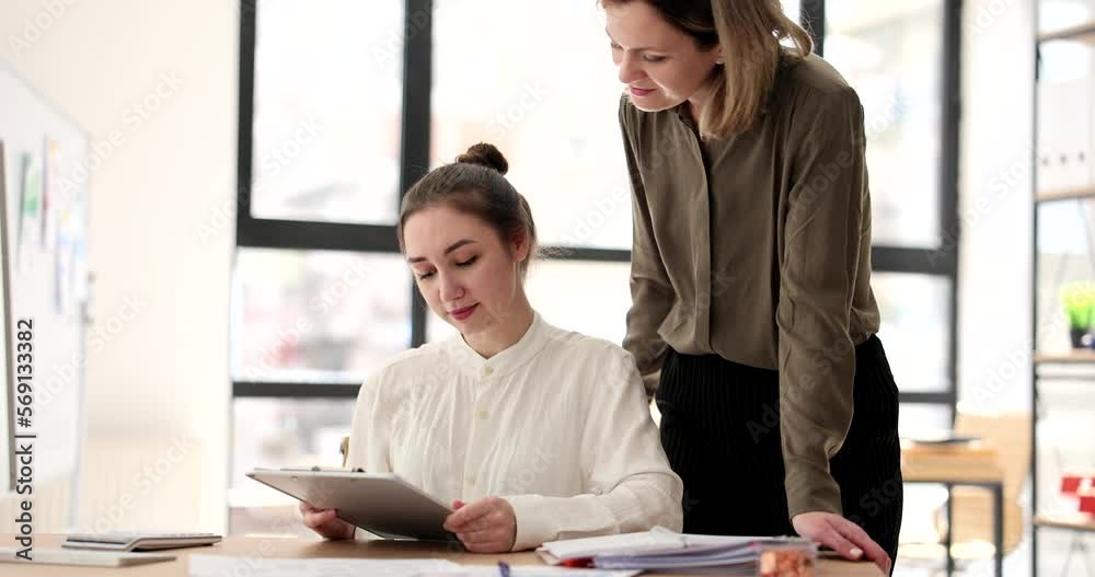 Business manager helping trainee deal with paperwork 4k movie slow motion Business manager helping trainee deal with paperwork 4k movie slow motion