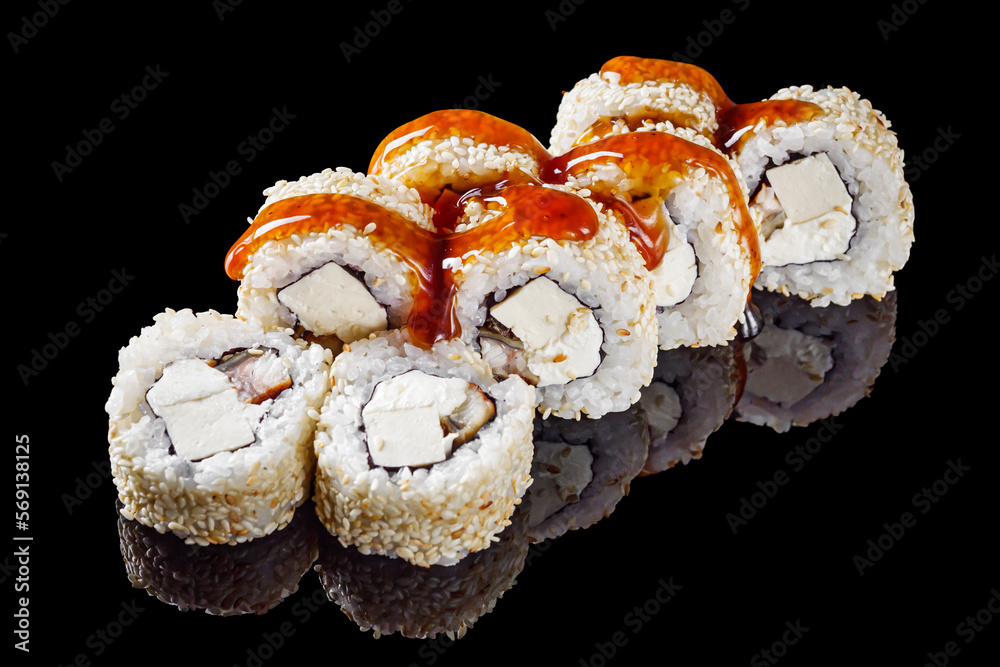 sushi roll with tofu cream cheese eel unagi on a black mirror background