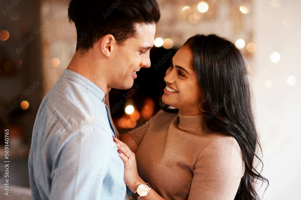 Love, romance and happy couple hugging on a date for valentines day, romantic event or anniversary. Happiness, smile and interracial man and woman embracing after a dinner celebration together.
