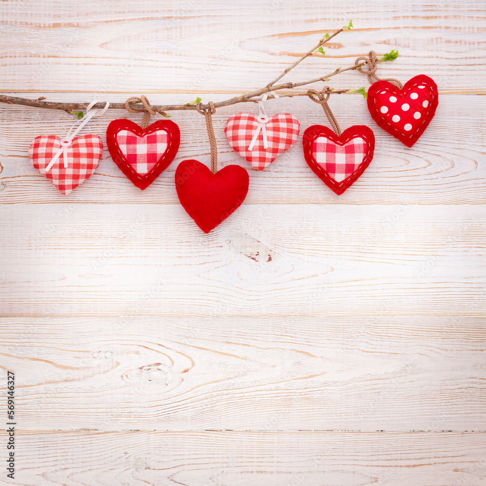 Valentine day love background. Hearts hanging on branch of tree Valentine day love background. Hearts hanging on branch of tree