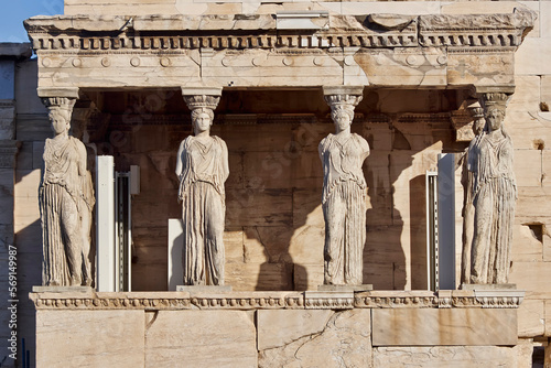 Caryatids, women figures statues at Erechtheion ancient Greek temple, on Acropolis hill. Cultural travel in Athens, Greece. photo