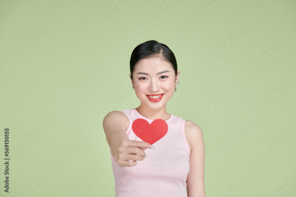 exhilarated woman holding a valentine greeting card in hands exhilarated woman holding a valentine greeting card in hands