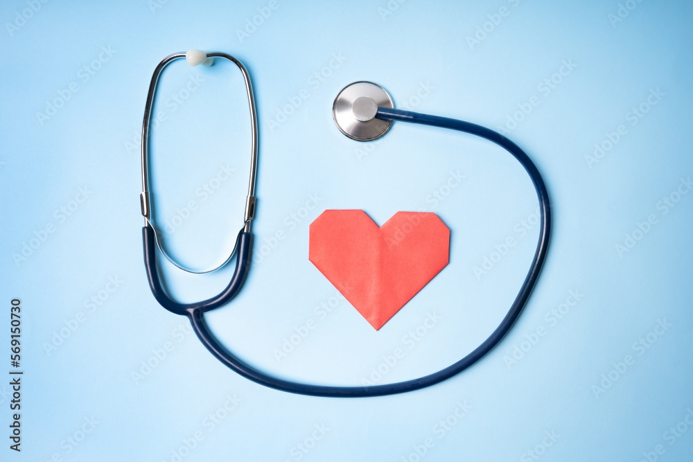 Red heart shape and stethoscope on blue background. Equipment for Medical, Health care and patient, Failure and Diseases concept. Heart health, health care concept. Red heart shape and stethoscope on blue background. Equipment for Medical, Health care and patient, Failure and Diseases concept. Heart health, health care concept.