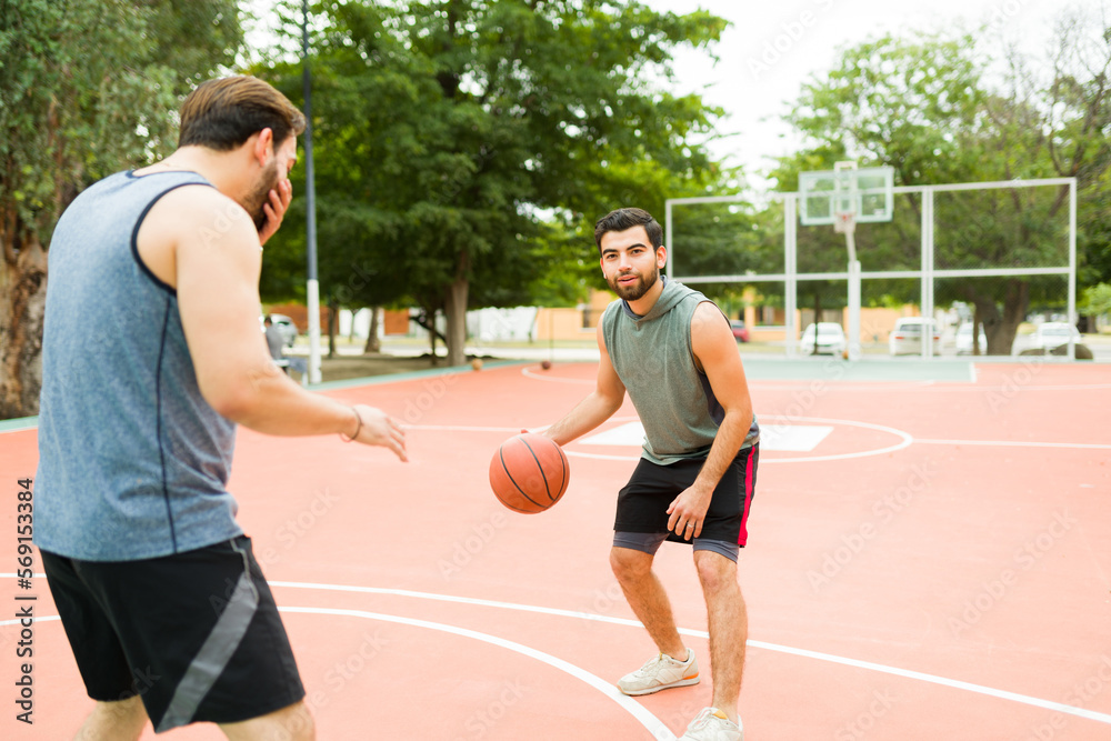 Active young men working out playing basketball Active young men working out playing basketball