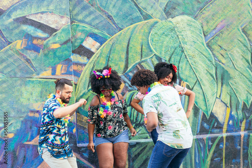 Group of friends having fun at a street party in Barranquilla, Colombia. photo