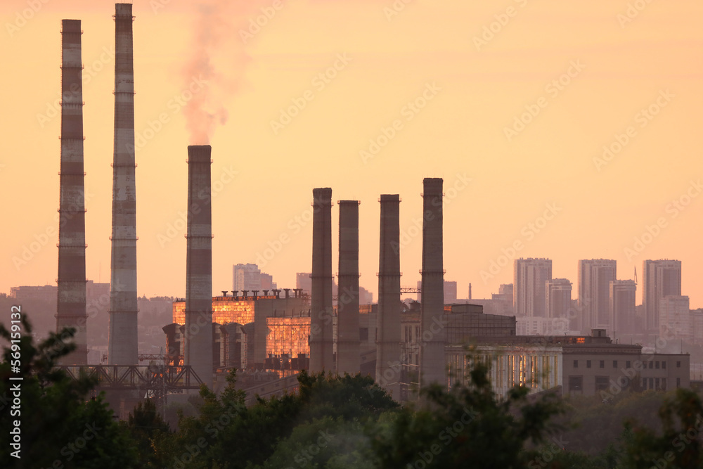 power station. industrial landscape with city background